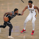 Brooklyn Nets’ Kyrie Irving, left, drives against New Orleans Pelicans’ Herbert Jones during the first half of an NBA basketball game Wednesday, Oct. 19, 2022, in New York.
